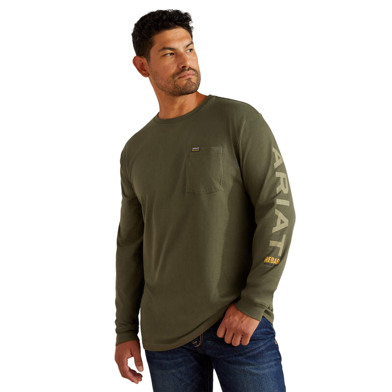 Man wearing a green long-sleeve shirt with 'Ariat' branding on a beige background